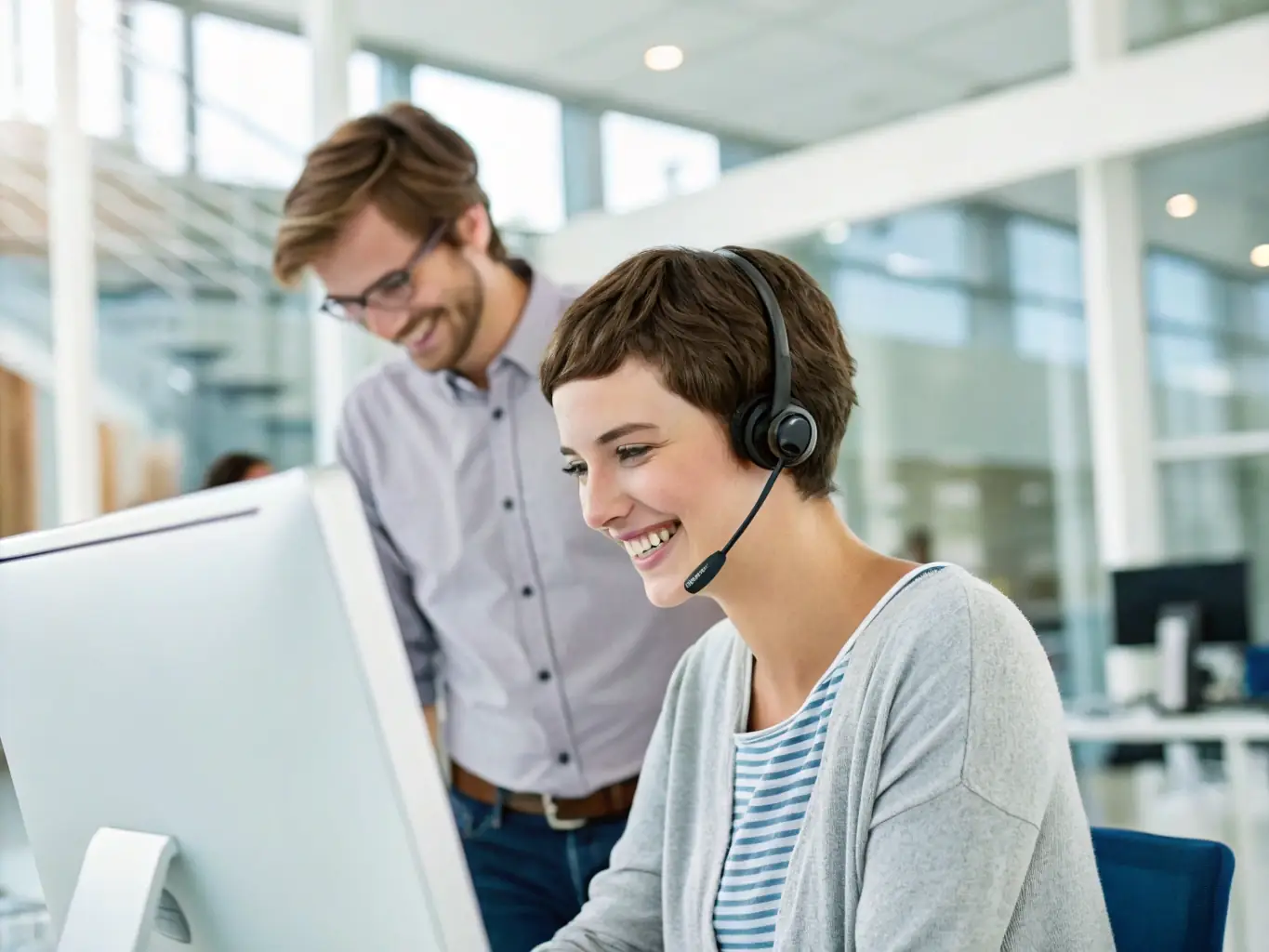 An image of a Proagent Gold Coast support team member assisting an agent with a query, emphasizing personalized assistance.